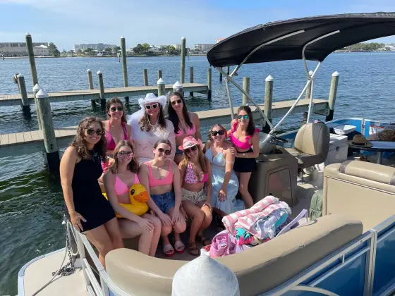 A bachelorette group relaxing on a private pontoon at the Crab Island sandbar
