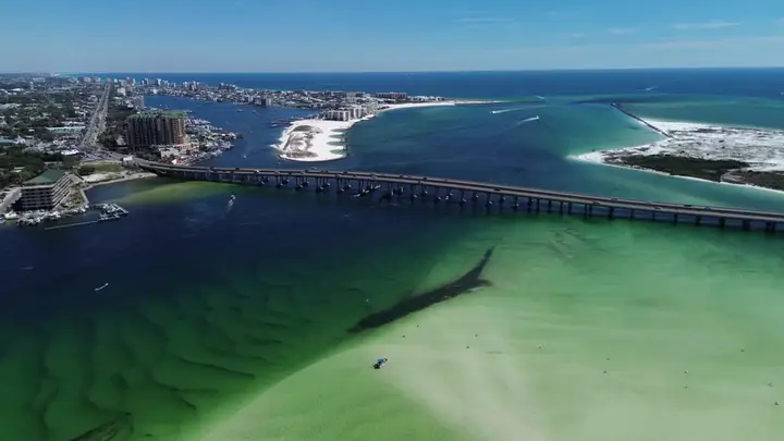 Aerial of the East Pass cut opening between Destin and Okaloosa Island onto the Gulf