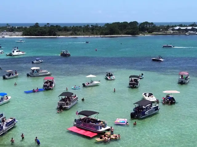Aerial of Destin Harbor and the East Pass channel opening to the Gulf