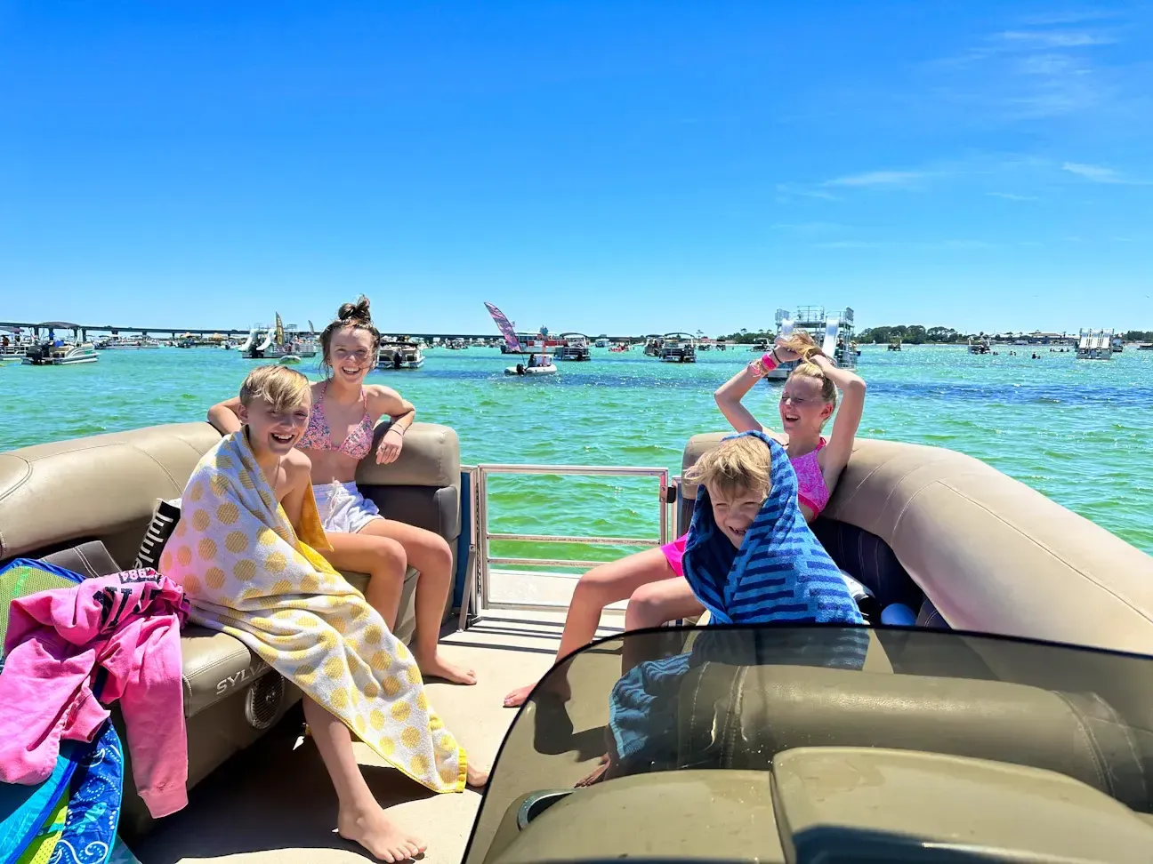 Kids enjoying a private pontoon charter on the Crab Island sandbar