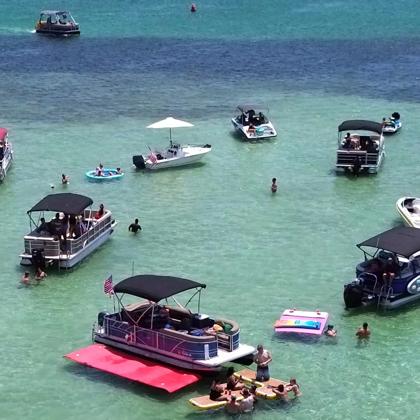 A private charter pontoon on the Crab Island sandbar in Destin